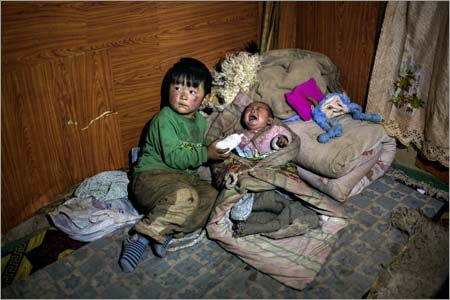 The children of a Tibetan herder in his 30s who recently self-immolated, leaving a wife and two small children, are seen in Sangke Village, near Xiahe, Gansu Province, China on Dec. 17, 2012.